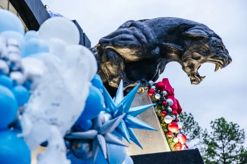 The stadium's panther statue decked out with balloons and ornaments